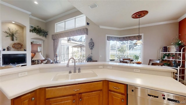 kitchen with a sink, visible vents, open floor plan, ornamental molding, and stainless steel dishwasher