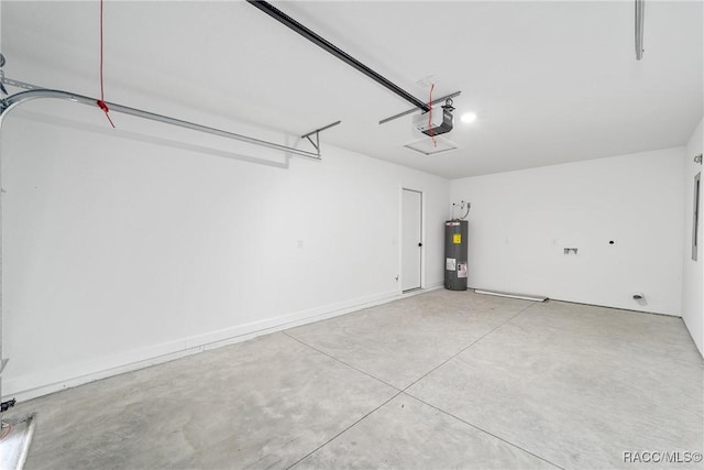 garage featuring water heater and a garage door opener