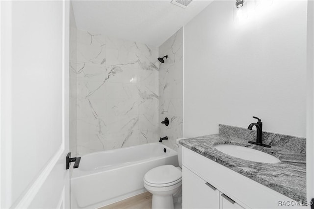 bathroom with toilet, tub / shower combination, wood finished floors, and vanity