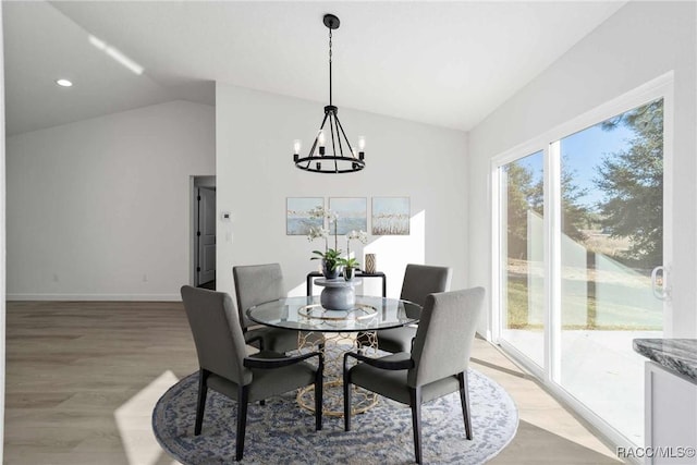 dining space with lofted ceiling, a chandelier, recessed lighting, baseboards, and light wood finished floors