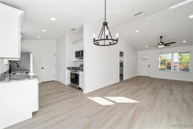 kitchen with stainless steel appliances, visible vents, white cabinets, open floor plan, and hanging light fixtures