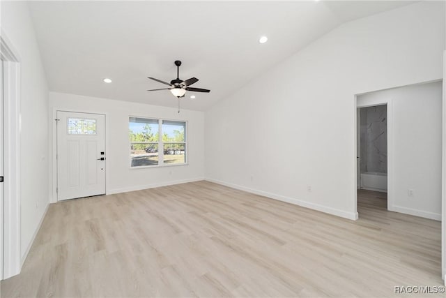 unfurnished living room featuring vaulted ceiling, recessed lighting, baseboards, and light wood-style floors