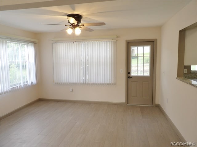 entryway featuring ceiling fan and light hardwood / wood-style floors