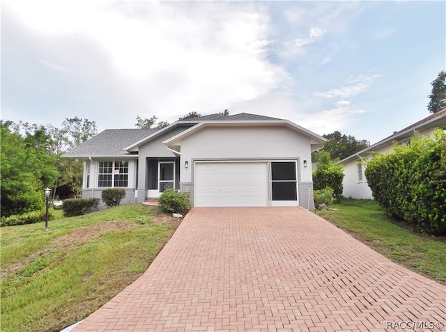 single story home with a front lawn and a garage