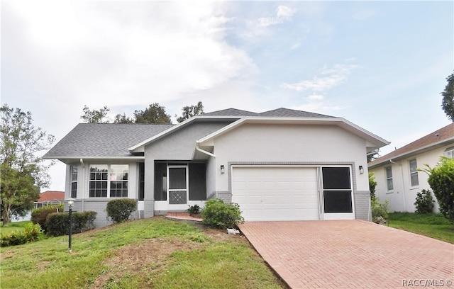 view of front of home featuring a garage and a front yard