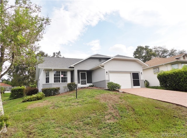 ranch-style home with a garage and a front yard