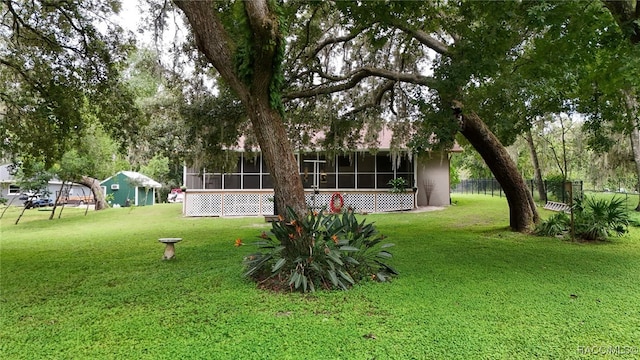 view of yard featuring a sunroom