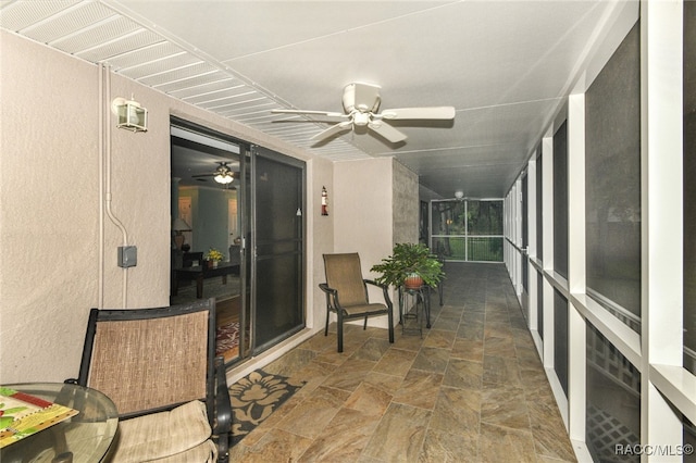 sunroom / solarium with ceiling fan