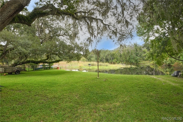 view of yard with a water view