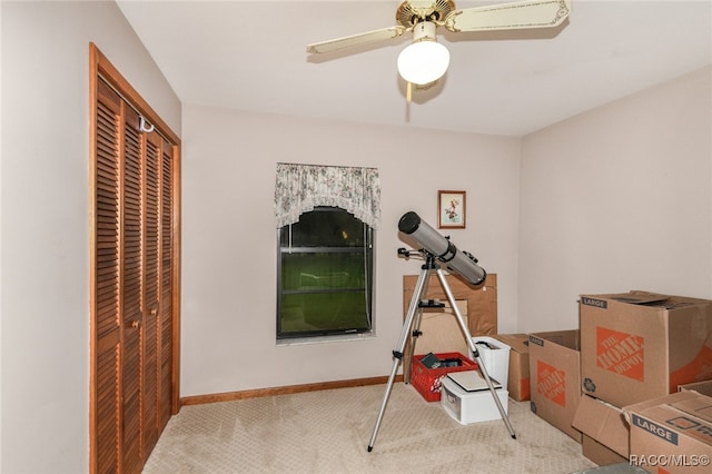 recreation room featuring ceiling fan and light colored carpet