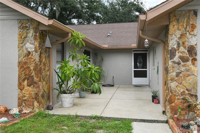 doorway to property with a patio