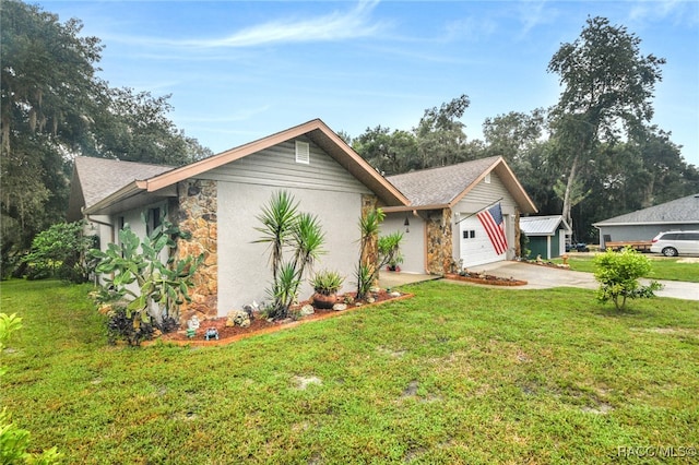 view of front of house featuring a garage and a front lawn