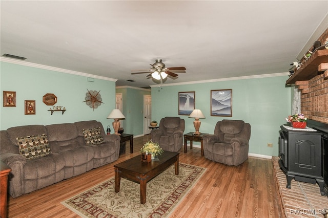 living room with ceiling fan, wood-type flooring, and crown molding