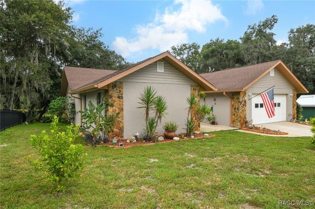 ranch-style home featuring a garage and a front yard