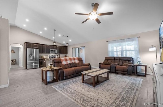 living room featuring lofted ceiling, ceiling fan, and light hardwood / wood-style flooring