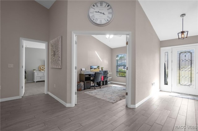 entrance foyer with high vaulted ceiling