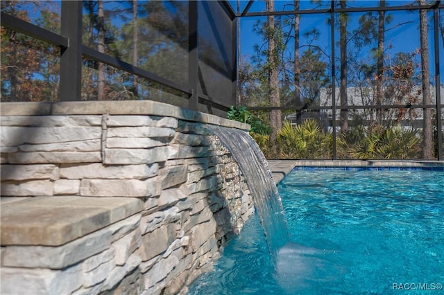 view of pool featuring pool water feature