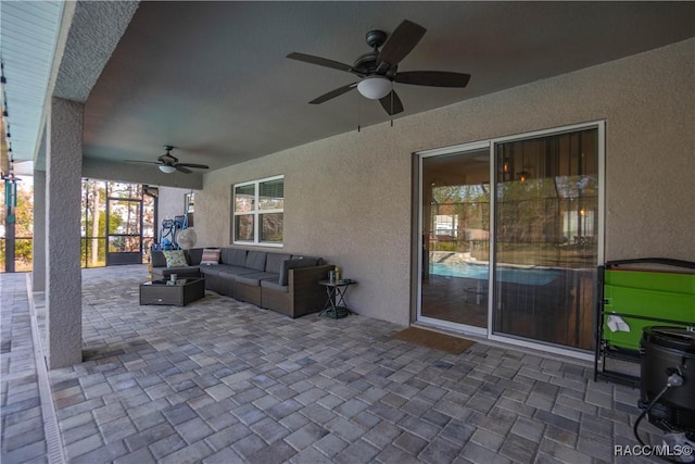 view of patio / terrace featuring an outdoor living space and ceiling fan