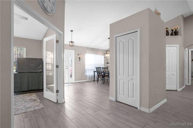 foyer entrance featuring lofted ceiling