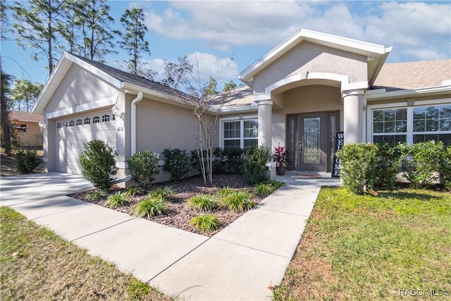 view of front of property featuring a garage and a front yard