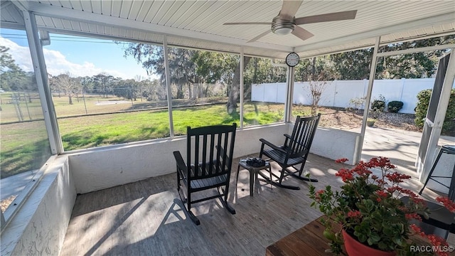 sunroom / solarium with ceiling fan