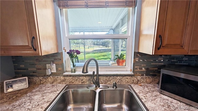 kitchen featuring sink and decorative backsplash