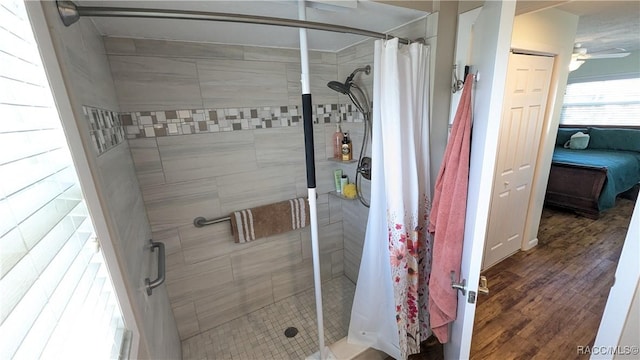 bathroom featuring hardwood / wood-style flooring and a shower with curtain