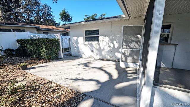 28 New Florida Ave, Beverly Hills, FL 34465 - view of patio featuring fence