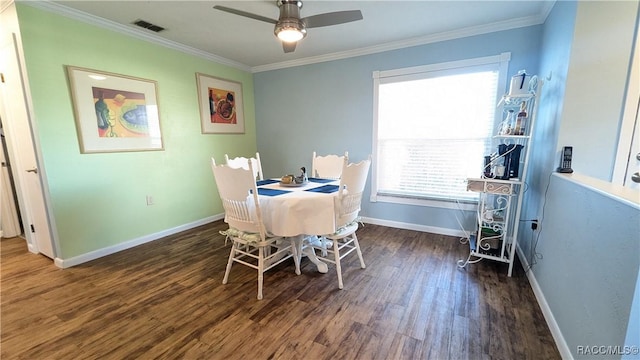 dining area with crown molding, ceiling fan, and dark hardwood / wood-style flooring