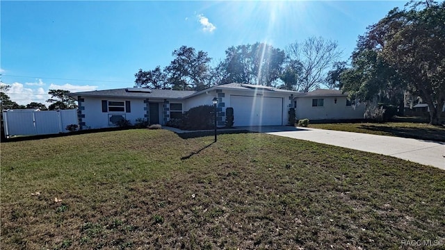 28 New Florida Ave, Beverly Hills, FL 34465 - ranch-style home featuring driveway, a front lawn, fence, and an attached garage