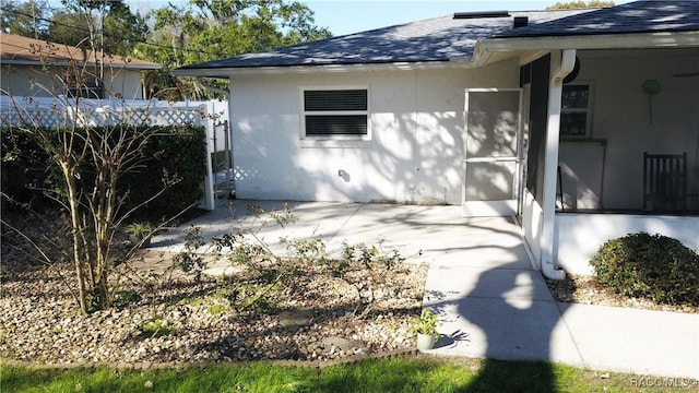 view of side of property featuring a patio