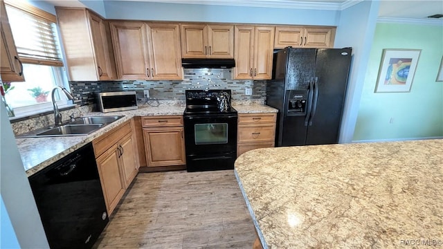 kitchen with crown molding, sink, decorative backsplash, and black appliances