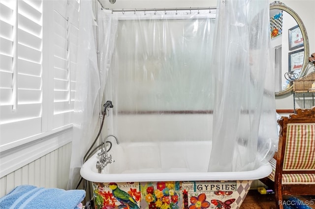 bathroom featuring shower / bathtub combination with curtain