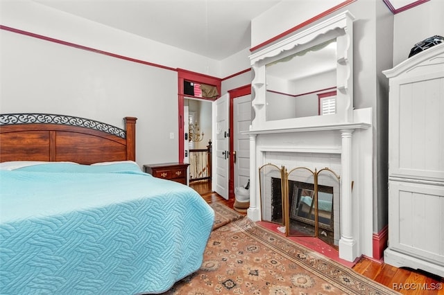 bedroom with hardwood / wood-style floors