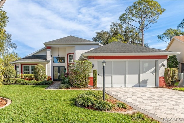 view of front of house featuring a front lawn and french doors