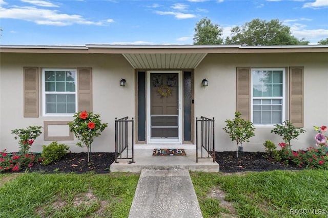 9125 N Abbot Dr, Citrus Springs, FL 34434 - property entrance featuring stucco siding and a porch