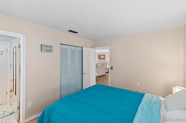 9125 N Abbot Dr, Citrus Springs, FL 34434 - bedroom featuring a closet and baseboards