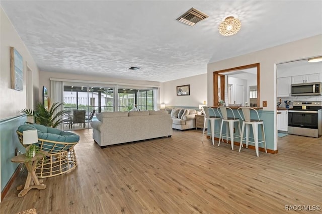 9125 N Abbot Dr, Citrus Springs, FL 34434 - living area featuring light wood-type flooring