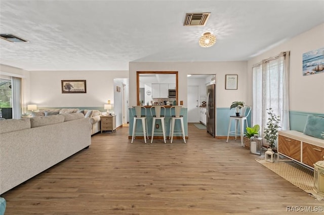 9125 N Abbot Dr, Citrus Springs, FL 34434 - living room featuring wood finished floors and baseboards