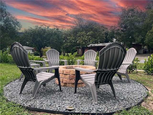 9125 N Abbot Dr, Citrus Springs, FL 34434 - patio terrace at dusk with an outdoor fire pit