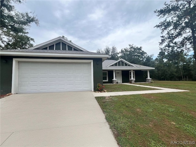 view of front facade featuring a front yard and a garage