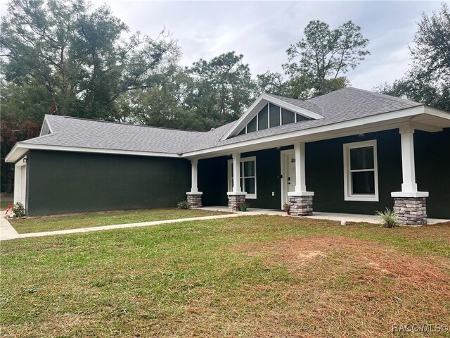 craftsman-style home featuring a front yard and a porch