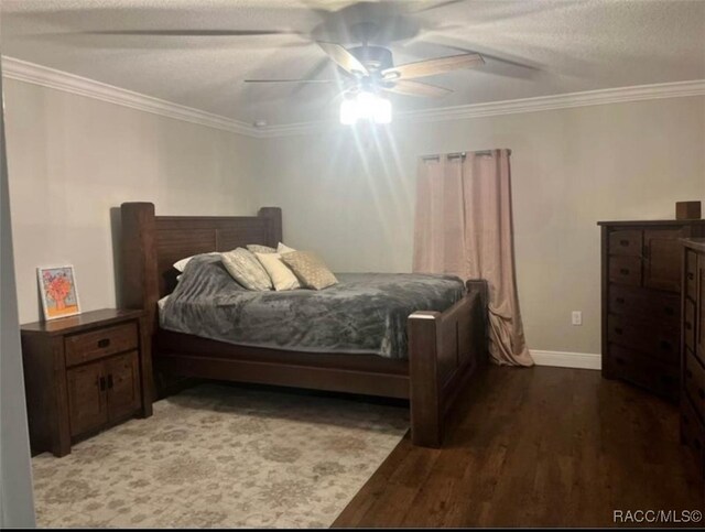 bedroom with ceiling fan, crown molding, and hardwood / wood-style flooring