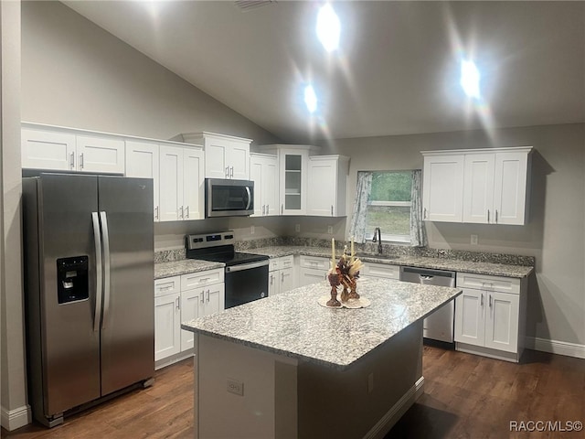 kitchen featuring white cabinets, lofted ceiling, and appliances with stainless steel finishes