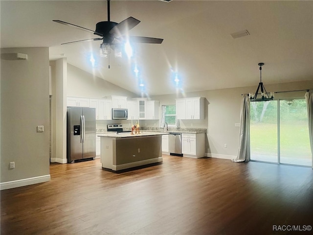 kitchen featuring white cabinetry, a center island, light hardwood / wood-style flooring, vaulted ceiling, and appliances with stainless steel finishes