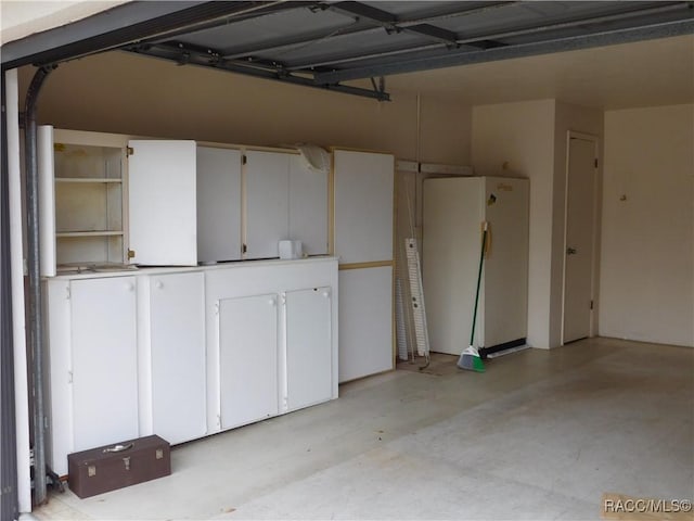 garage with white refrigerator