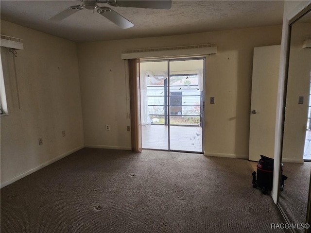 spare room with carpet floors and ceiling fan