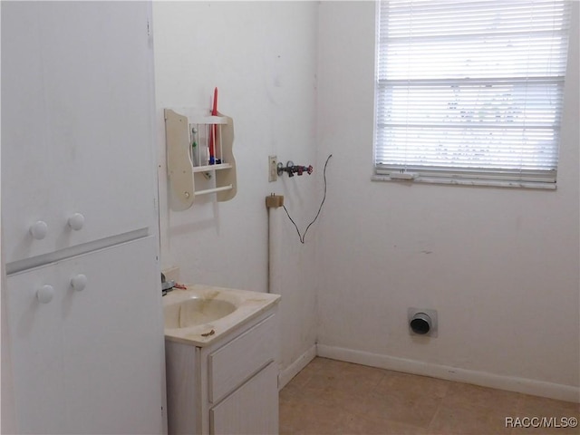 bathroom with tile patterned floors and vanity