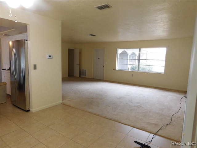 empty room with light colored carpet