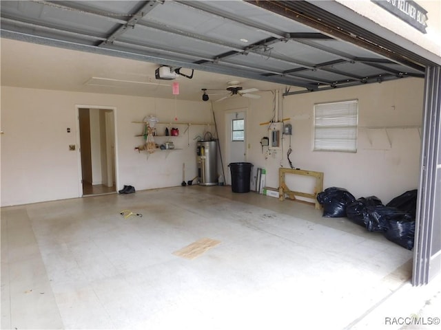 garage with water heater and a garage door opener